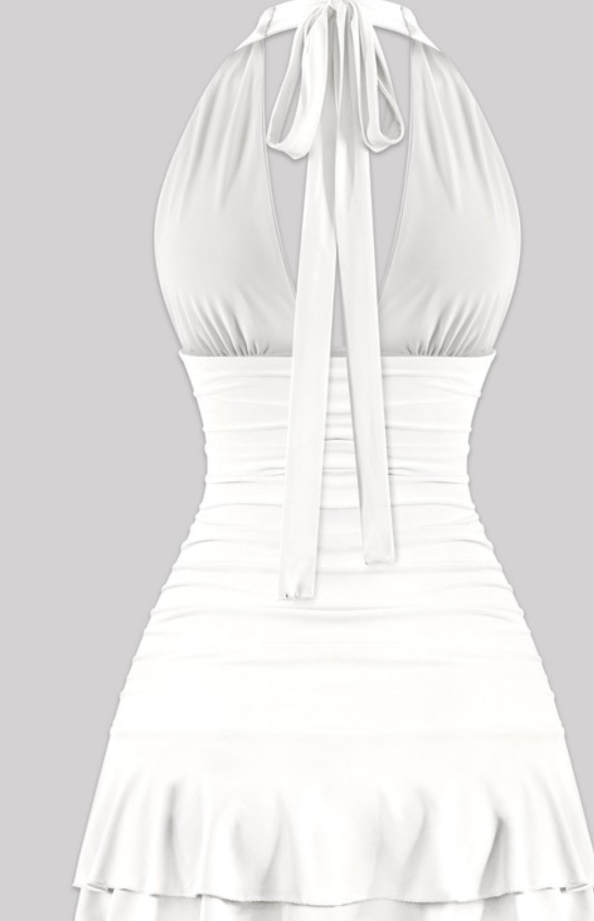 White halter mini dress with deep V neckline, ruched sides, and layered ruffle hem – flirty summer dress or bachelorette party outfit for women.