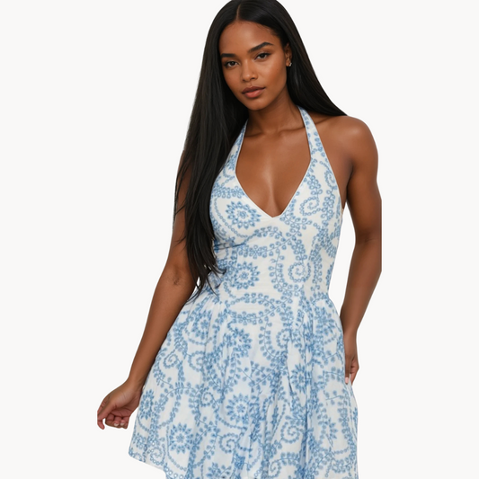 Blue and white halter mini dress with floral swirl print and deep V neckline – summer party dress or beach vacation outfit for women.