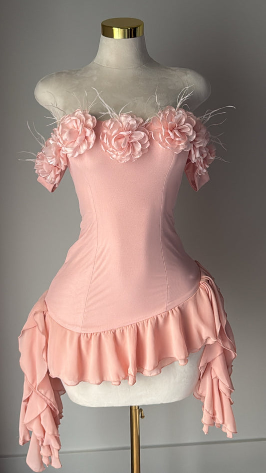 Blush pink off-shoulder mini dress with 3D floral details, feather accents, and layered ruffle hem – romantic occasion dress or birthday outfit for women.